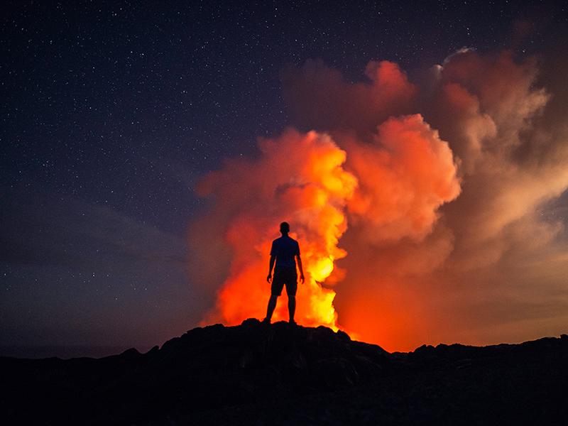 The image features Jack Fusco standing in front of lava.