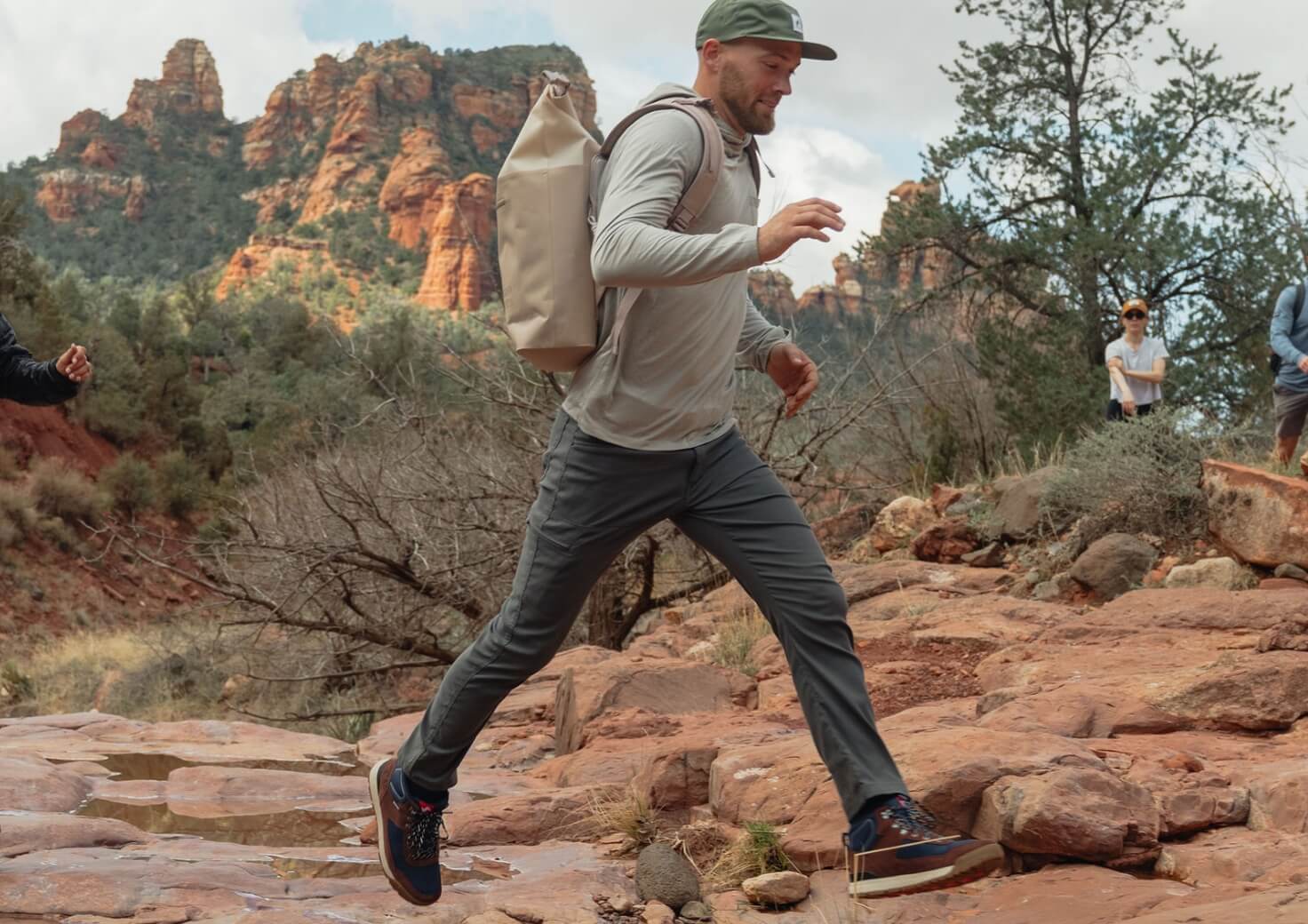 Shop Forsake men's featuring a man wearing the Fifteen mid shoe on a hike.