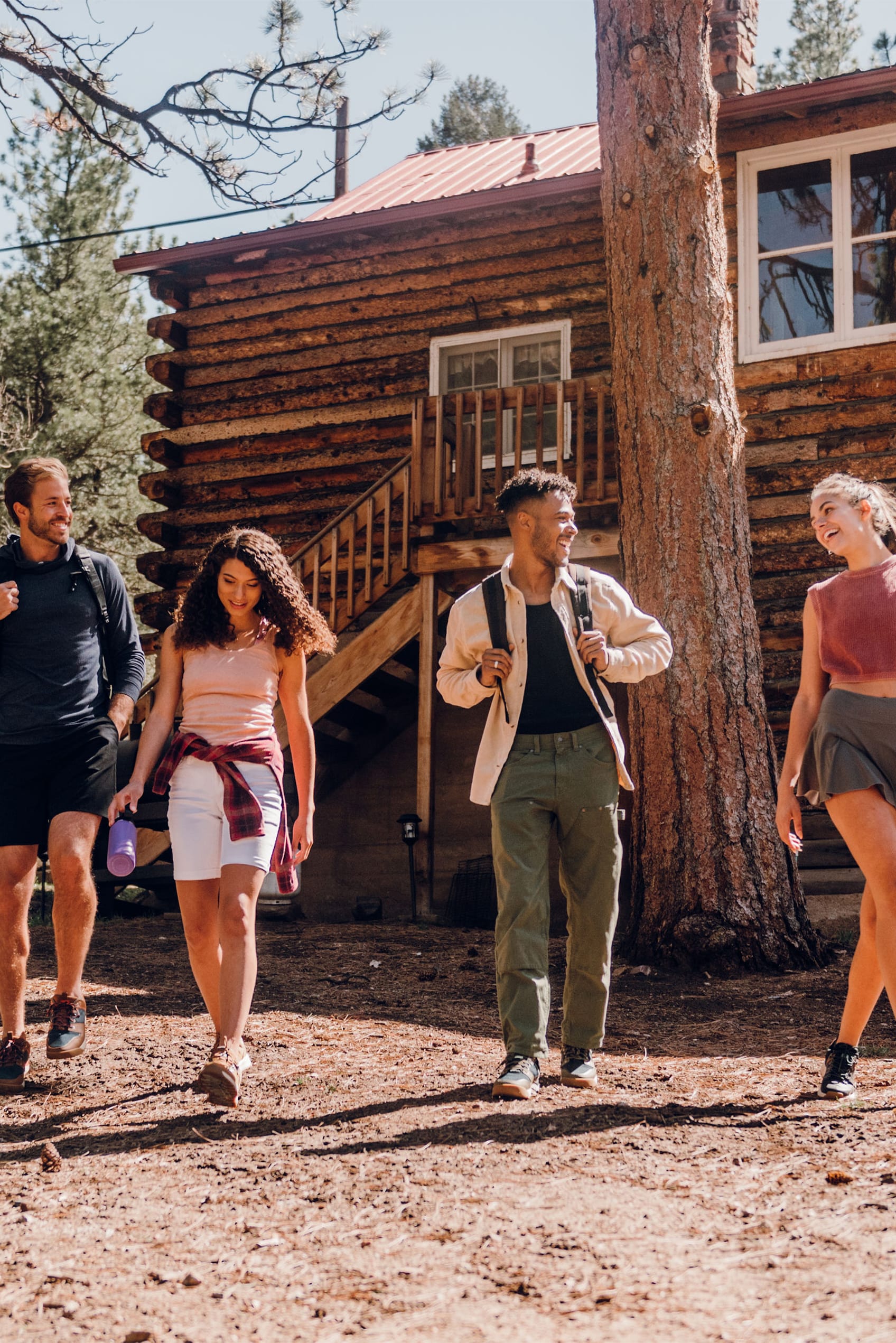 The featured image shows four adults wearing Forsake shoes walking in front of a log cabin.