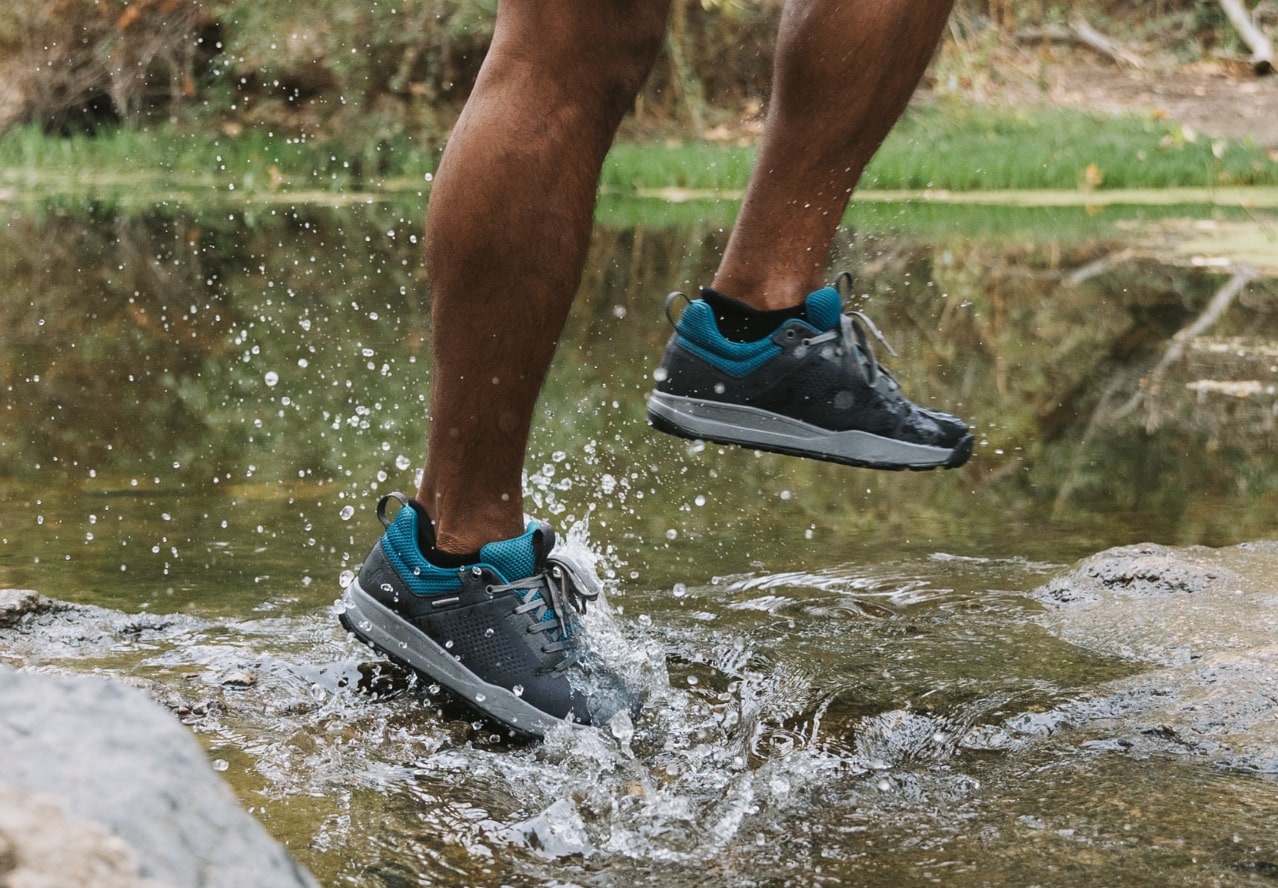 Click to shop men's or women's waterproof shoes. Image features the Dispatch Low in gunmetal.