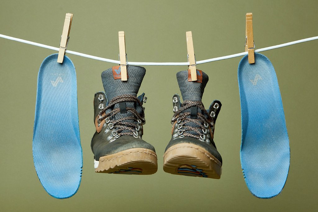 The image features Forsake Boots and its insoles hangdrying. 